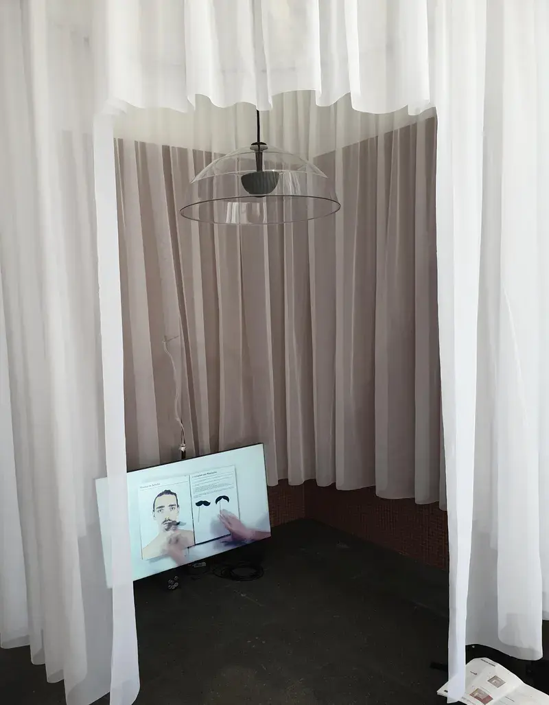 Sheer white voile forming a see-through enclosure in a gallery