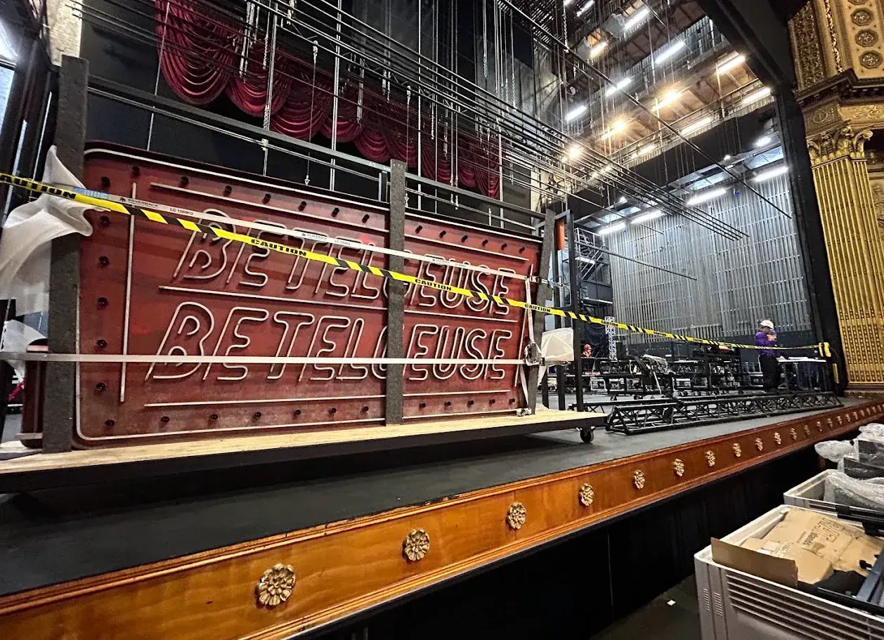 Beetlejuice neon show sign lit on stage