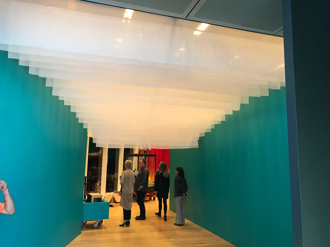 A tiered white voile canopy suspended over a gallery walkway at Melbourne Museum